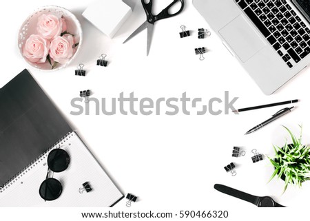White office desk frame with laptop keyboard and supplies. Laptop, notebook, pen, roses, plant, sunglasses, clips, scissors, watch and office supplies on white background. Flat lay, top view, mockup