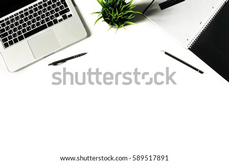 White office desk with laptop keyboard and supplies. Laptop, notebook, pen, clips, pencil, plant and office supplies on white background. Flat lay, top view, mockup