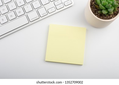 White office desk table with computer keyboard and other office supplies. Top view with copy space, flat lay.