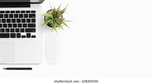 White office desk table with laptop and supplies. Top view with copy space, flat lay. - Shutterstock ID 628204196
