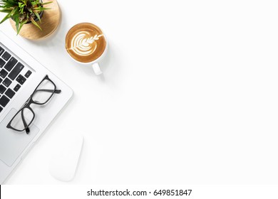 White Office Desk Table With Laptop Computer, Cup Of Latte Coffee. And Supplies Top View With Copy Space, Flat Lay.