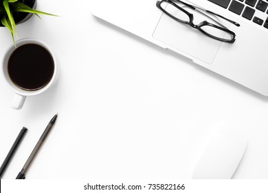 White Office Desk Table With Laptop, Cup Of Coffee And Office Supplies. Top View With Copy Space, Flay Lay.