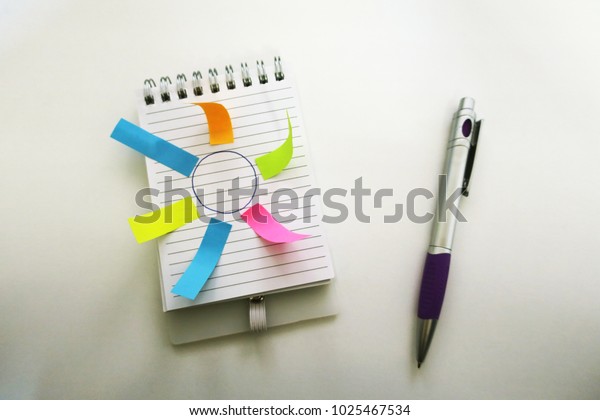 white office\
notebook and colored\
stickers