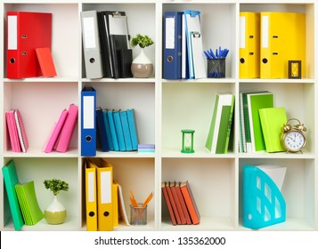 White office shelves with different stationery, close up - Shutterstock ID 135362000