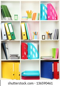 White office shelves with different stationery, close up - Shutterstock ID 136590461