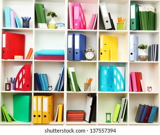 White office shelves with different stationery, close up - Shutterstock ID 137557394