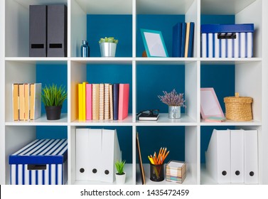 White office shelves with different stationery, close up - Shutterstock ID 1435472459