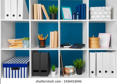 White Office Shelves With Different Stationery, Close Up