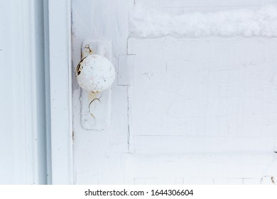 White Old Grunge Wood Door With Doorknob And Snow