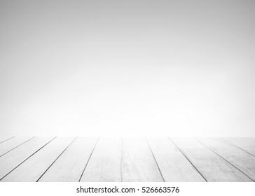 White Old Wood Floor With Blurred Blue Gray Tone Background. Wooden Planks Stage Texture And Blur Flare Sunlight. Abstract Medical Backdrop. Focus To Table Top In The Foreground.