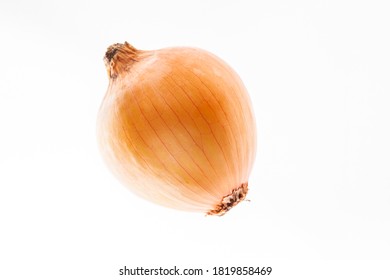 White onion bulb with golden shell isolated on the white background