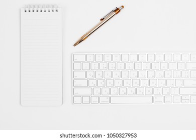 the white open notepad and computer keypad isolated on the white background