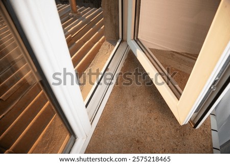 White opened plastic pvc window at home.