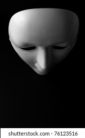 White opera mask on black background