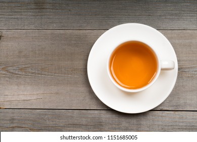 white organic green tea cup on rustic table - Shutterstock ID 1151685005