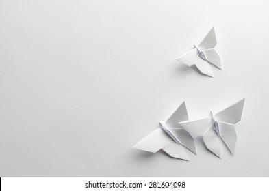 White Origami Butterflies On White Background