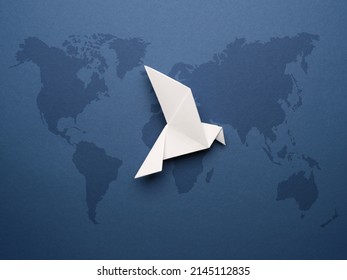 White Origami Pigeon On A Blue Paper Background, Peace Or Freedom Concept, Paper Art Work