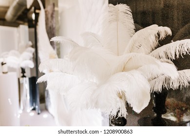 White ostrich feather wedding decoration of restaurant.