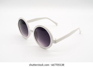 White oversized plastic sunglasses isolated white background  Trendy round   thick frame fashion and black gradient lens  Different angle view 