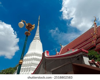 White pagoda and golden swan-shaped lamp post. - Powered by Shutterstock