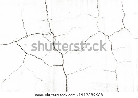 White paint black cracks background. Scratched lines texture. White and black distressed grunge concrete wall pattern for graphic design. Peel paint crack. Weathered rustic surface. Dry paint overlay.