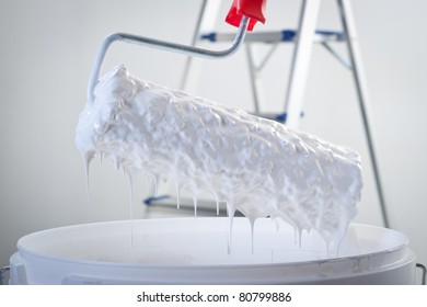 White Paint Dripping With Paint Roller