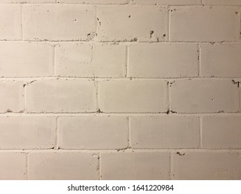 White Painted White Breeze Block Wall. Well Battered And Worn