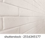 White painted brick wall background.