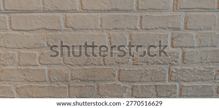 White painted brick wall background with square texture pattern, suitable for interior backdrop, minimalist design, and architectural surface concept.