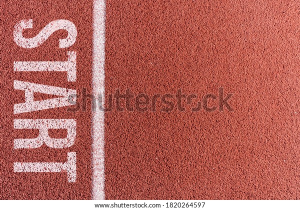 White painted line on tartan ground track in a\
athleticism and sports field.\
