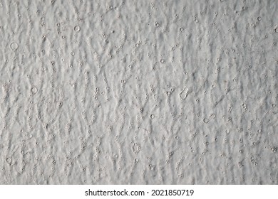 White painted surface with creases and bubbles