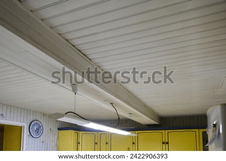 White panelled ceiling in an old kitchen.