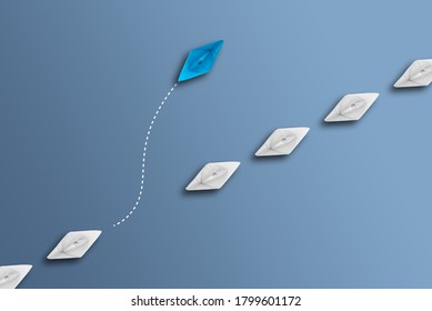 White Paper Boats In A Row On Blue Background And One Paperboat Going In Different Direction, Breaking New Grounds And Ndividualism Concept