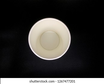 White Paper Cup On Black Background Top View