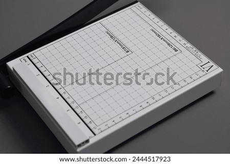 White Paper Cutter isolated on grey background