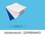 White paper desk calendar flipping page isolated on blue background