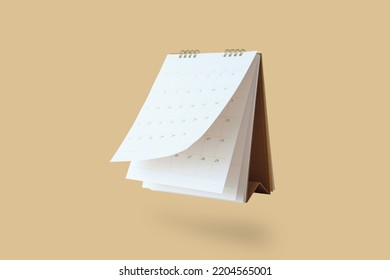 White paper desk calendar flipping page mockup isolated on brown background - Shutterstock ID 2204565001