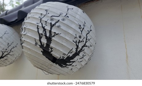 white paper lanterns with artistic patterns