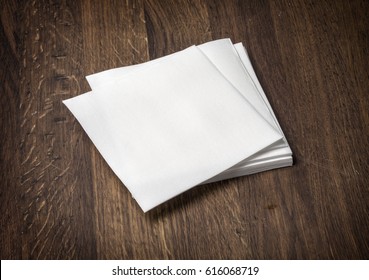 white paper napkin on old wooden table - Shutterstock ID 616068719