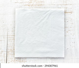 White Paper Napkin On Wooden Table