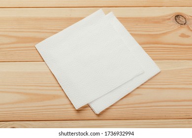 white paper napkin with a textured pattern on an old table - Shutterstock ID 1736932994