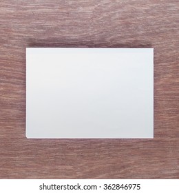 White Paper on wood Table - Shutterstock ID 362846975