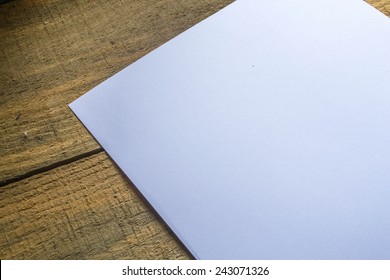 white paper on wooden