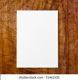 White Paper Pad On Antique Or Aged Wooden Table