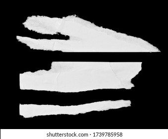 White paper pieces isolated on black background. Ripped wrinkled glued paper poster texture
