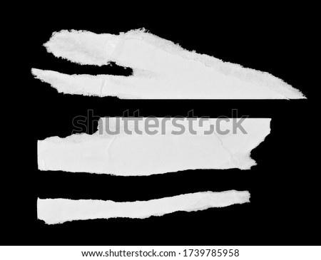 White paper pieces isolated on black background. Ripped wrinkled glued paper poster texture