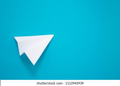 White Paper Plane On A Blue Background. Telegram Symbol