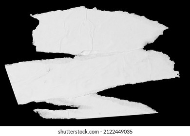 White paper ripped pieces isolated on black background. Dirty wrinkled glued paper poster texture