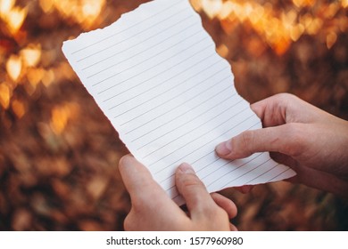 White Paper Slip In The Hands Of A Groom Who Reads A Wedding Vow: A Place For Your Text