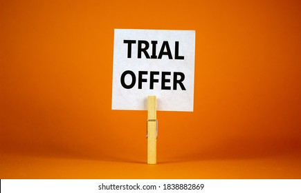 White Paper With Text 'trial Offer', Clip On Wood Clothespin. Beautiful Orange Background. Business Concept Or Product Service Offered Free Of Charge To Try To Give Feedback. Copy Space.